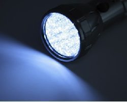 Flashlight shining in the dark.